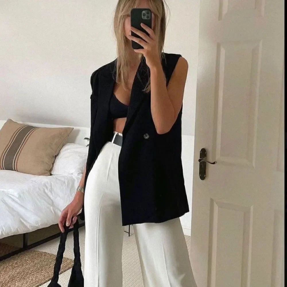 Black sleeveless blazer